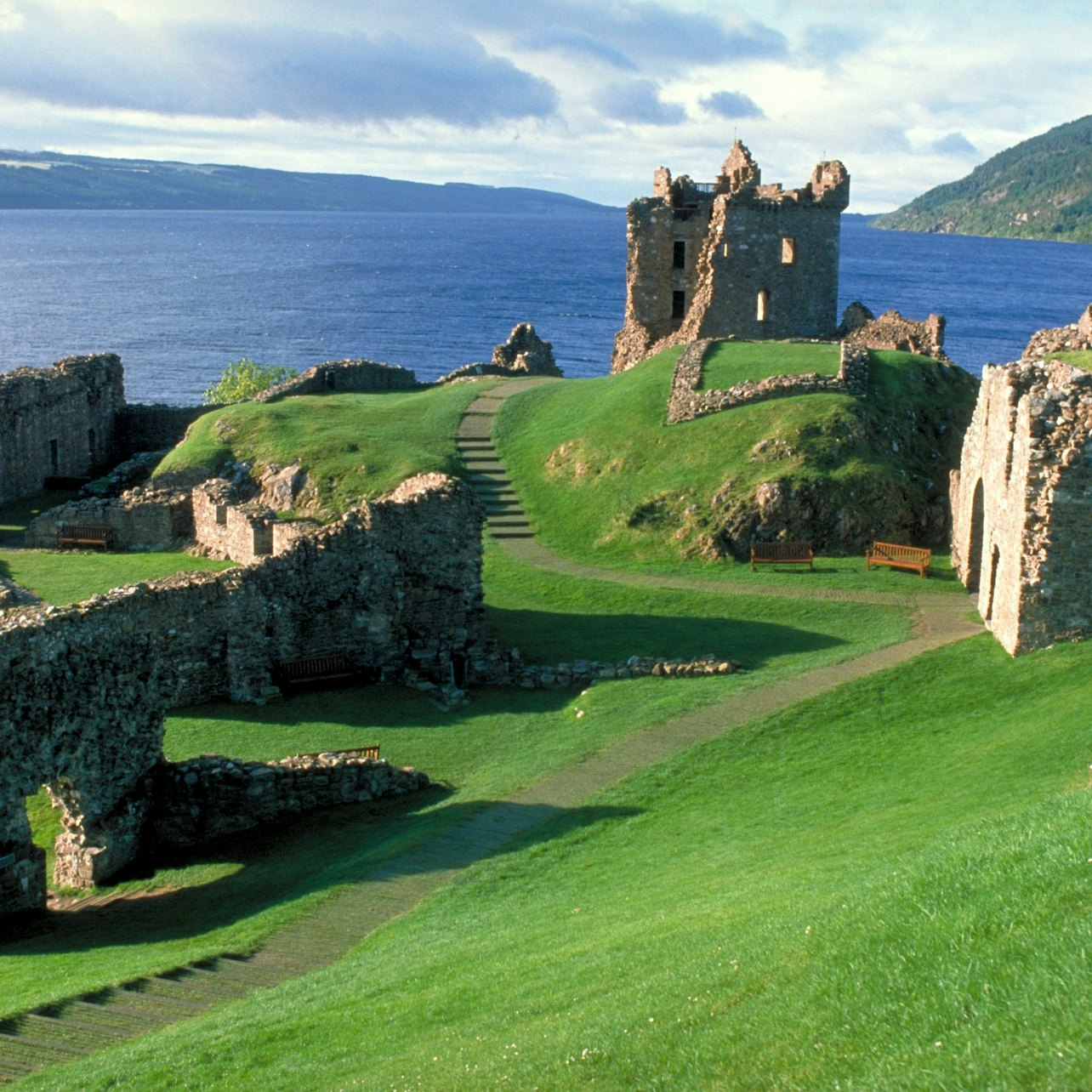 Explore the stunning shores of Loch Ness where ancient ruins meet shimmering waters offering a chance to connect with Scotland's rich history and legendary tales.